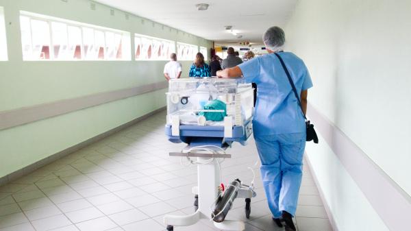 Health practitioner wheels gurney