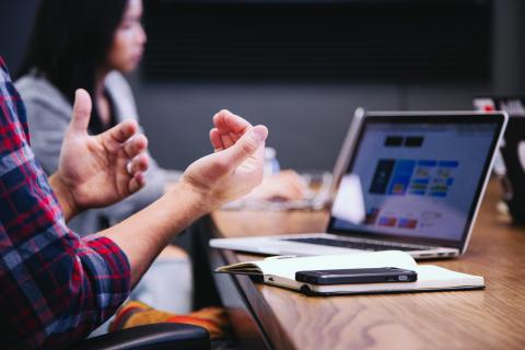 Woman's hands as she uses a laptop