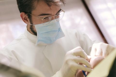 Photo of a health practitioner with mask at work