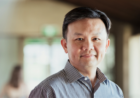 Man smiling with blurred background